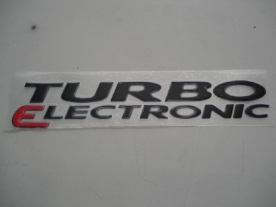 Emblema 'Turbo Eletronic' S10 03/... Preto/Grafite