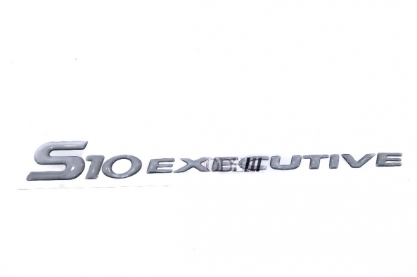 Emblema 'S10 Executive' 03/... Resinado Prata